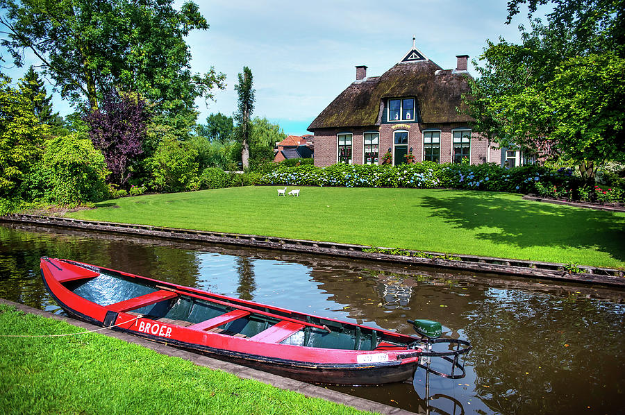 Red Boat. Giethoorn. The Netherlands Photograph by Jenny Rainbow