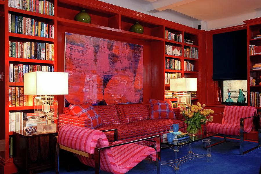 Red Bookcase In Modern Living Room With Large Painting And Blue Floor ...