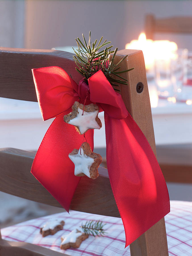 Red Bow With Cinnamon Stars And Pseudotsuga Tip Photograph by Friedrich Strauss