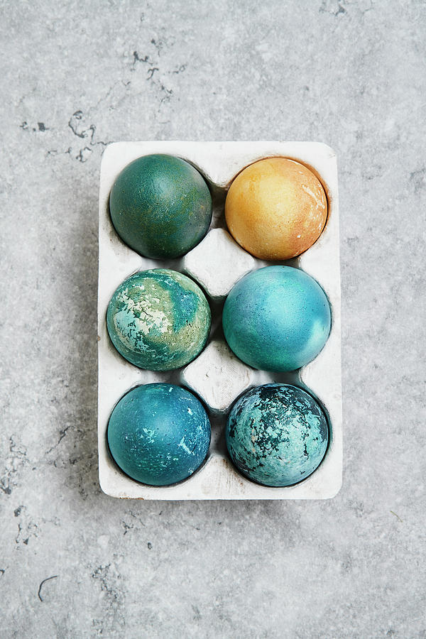 Red Cabbage And Turmeric Dyed Easter Eggs Photograph by Brigitte Sporrer