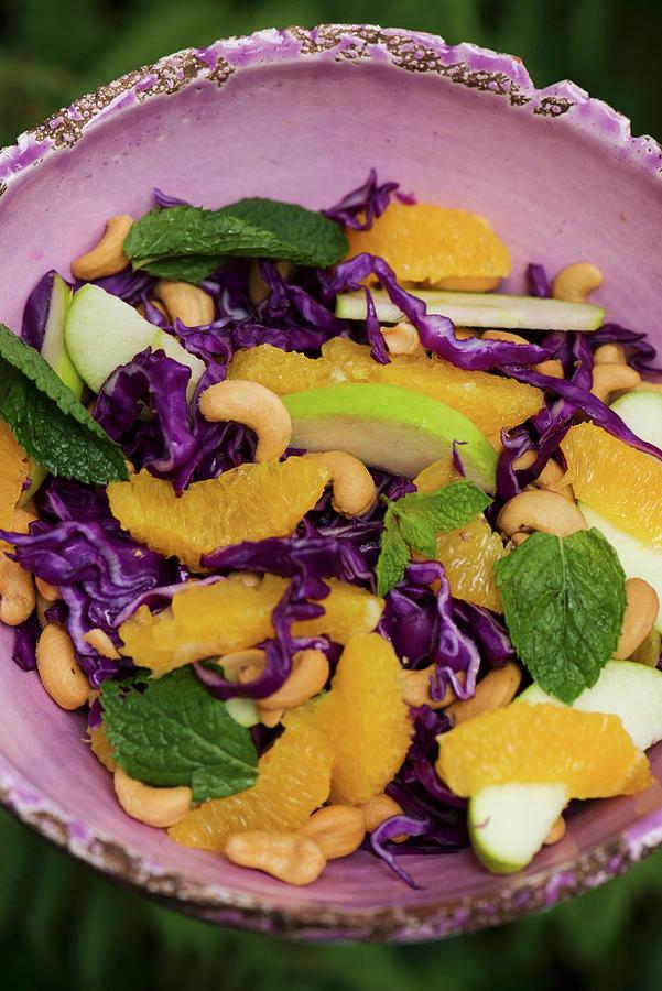 Red Cabbage Salad With Oranges, Apples And Cashew Nuts Photograph by Benno De Wilde Photography