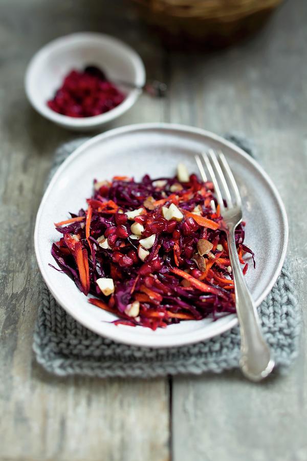 Red Cabbage Salad With Pomegranate And Brazil Nuts Photograph by Sporrer/skowronek