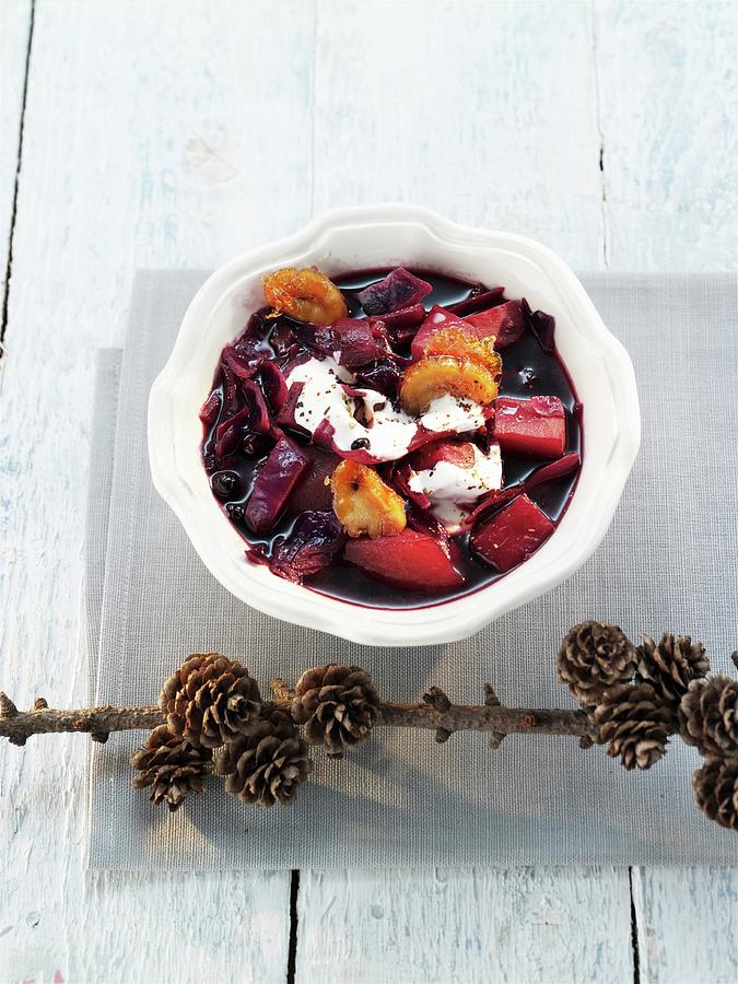 Red Cabbage Stew With Dried Fruits And Creme Fraiche christmas Photograph by Manfred Jahrei