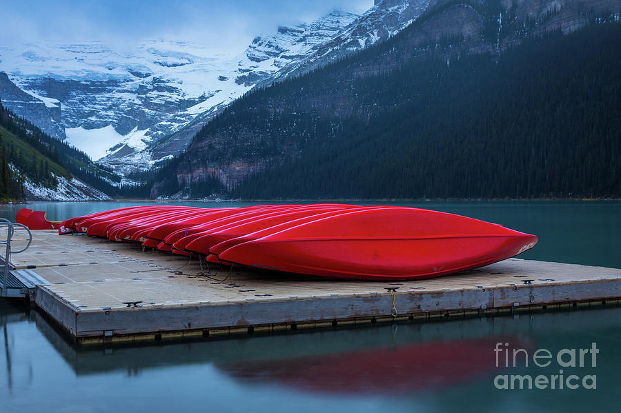 Red canoes on the dock Photograph by Inge Johnsson