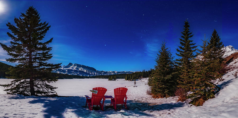 Red Chairs Under A Moonlit Winter Sky Photograph by Alan Dyer