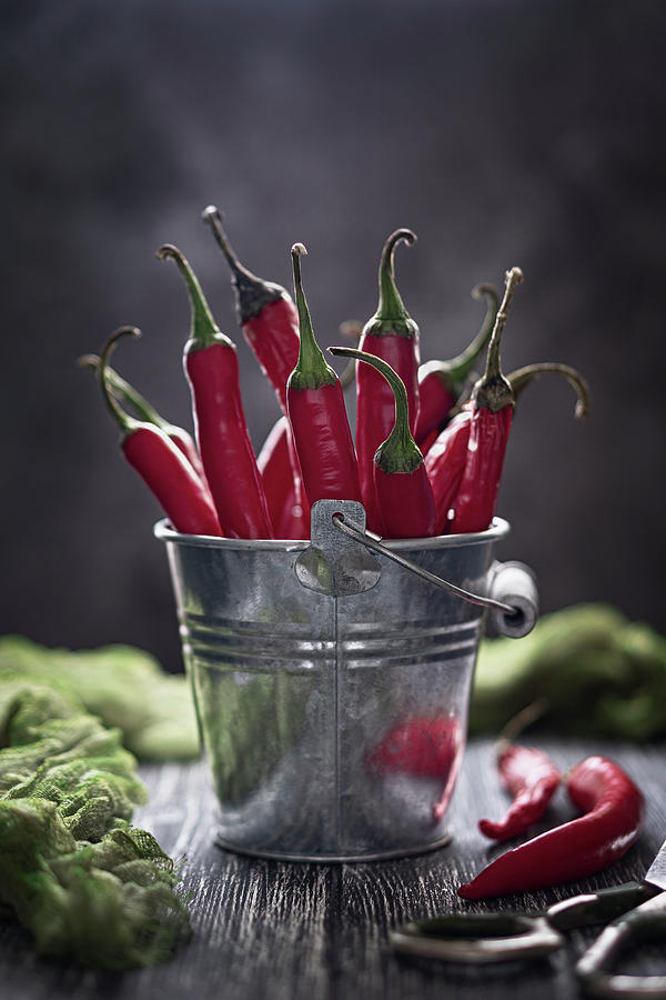 Red Chilli Peppers In A Small Bucket Photograph by Julie Taras