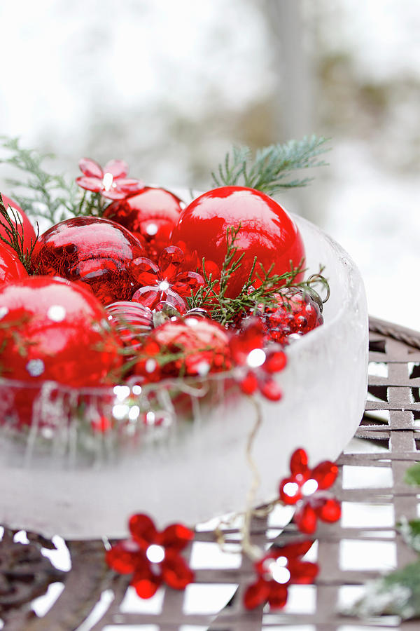 Red Christmas Baubles In Ice Bowl With Fairy Lights Photograph by Angelica Linnhoff