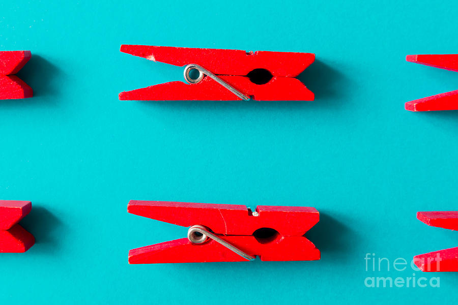 Color Photograph - Red Clothespins On Cyan Background by Zamurovic Photography Color Photograph - Red Clothespins On Cyan Background by Zamurovic Photography