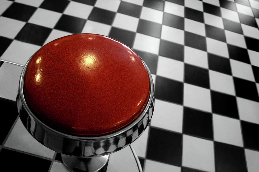 Red Cushion Stool Above Chequered Floor Photograph by Peter Young