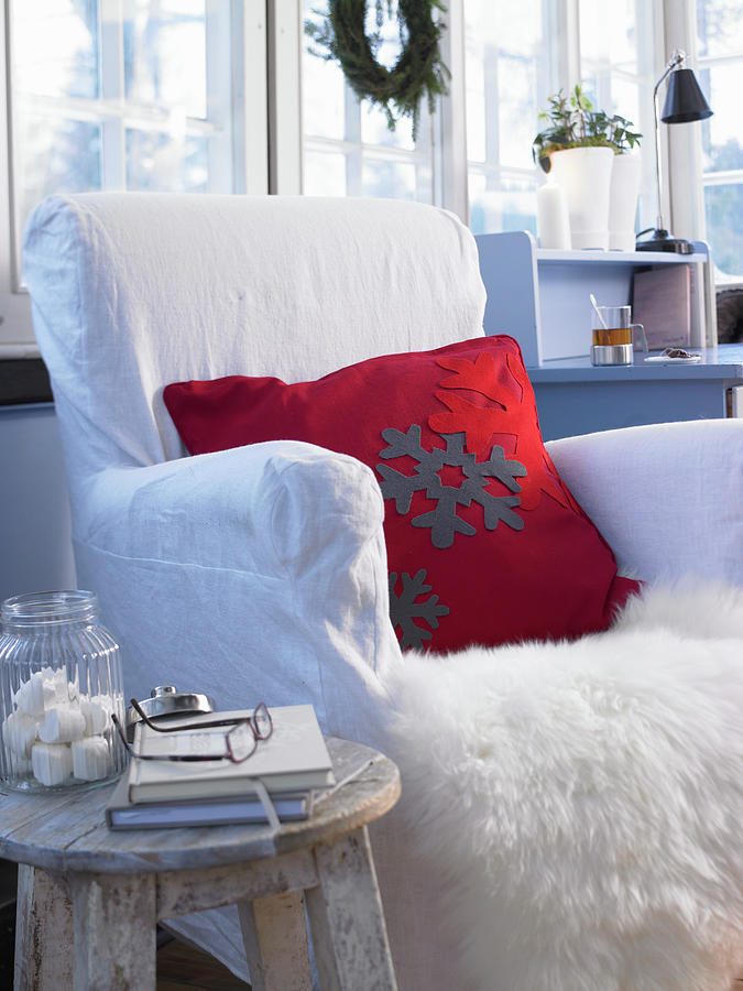 Red Cushion With Felt Appliqu Snowflakes On Fur Blanket On Armchair Photograph by Medri - Szczepaniak
