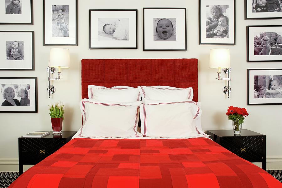Red Double Bed Framed By Large Collection Of Black And White Photographs Photograph by Brbel Miebach