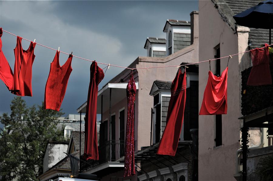Red Dress Run Red Dresses Hanging On A Line In The French Quarter Of New Orleans Photograph by Michael Hoard