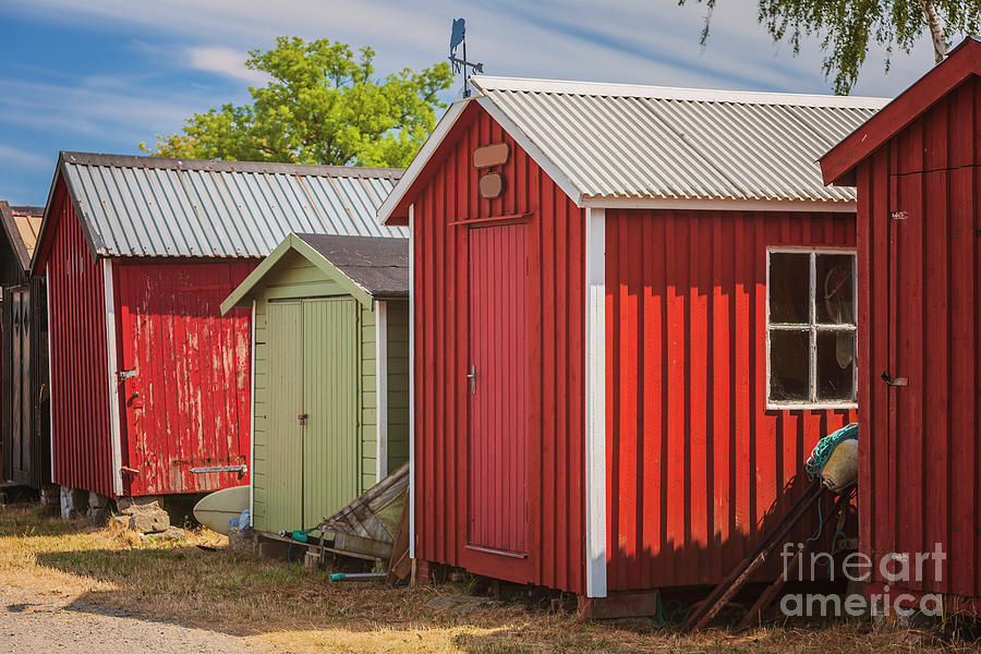Red fishing huts Photograph by Sophie McAulay