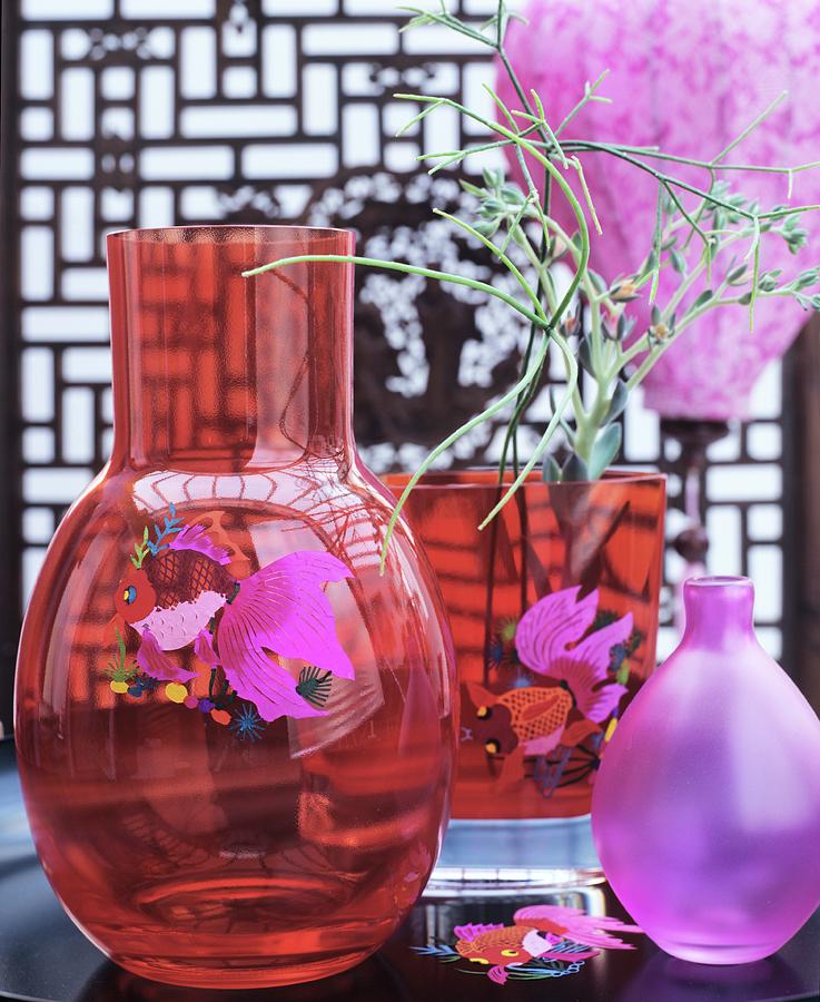 Red Glass Vases With Fish Motifs And Pink Vase Photograph by Matteo Manduzio