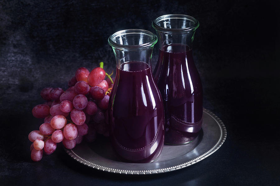 Red Grape Juice In A Glass Carafes Photograph by Barbara Pheby