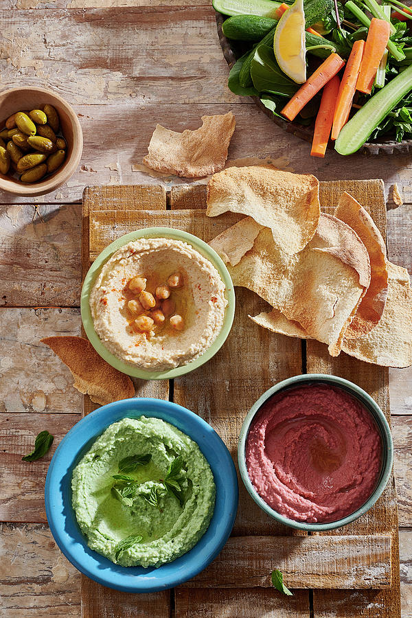 Red, Green And Yellow Hummus With Flatbread Photograph by Yehia Asem El Alaily