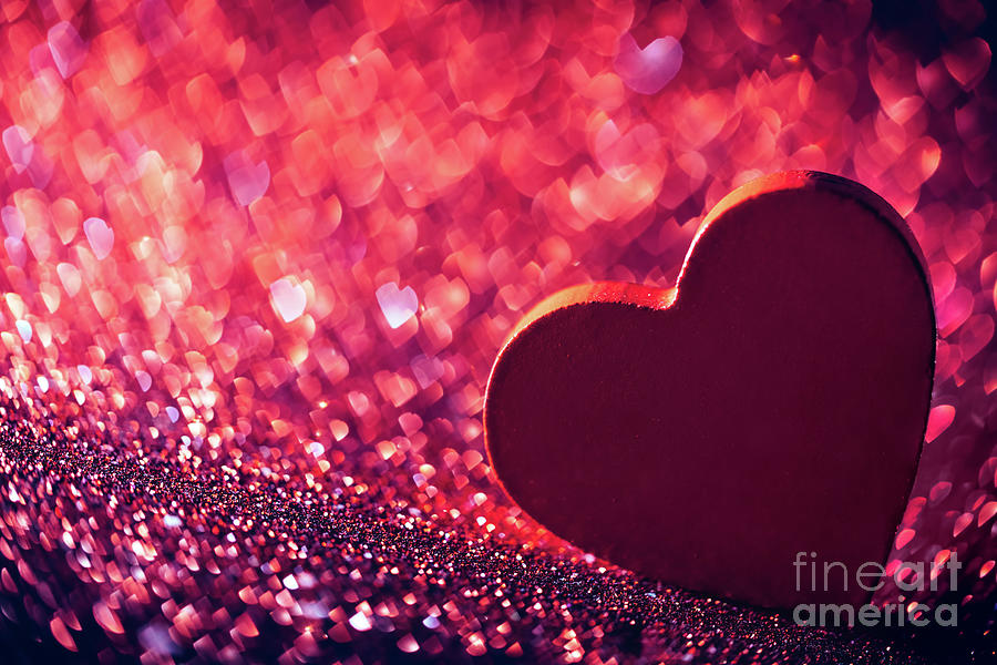Red heart on red glittery background. Photograph by Michal Bednarek