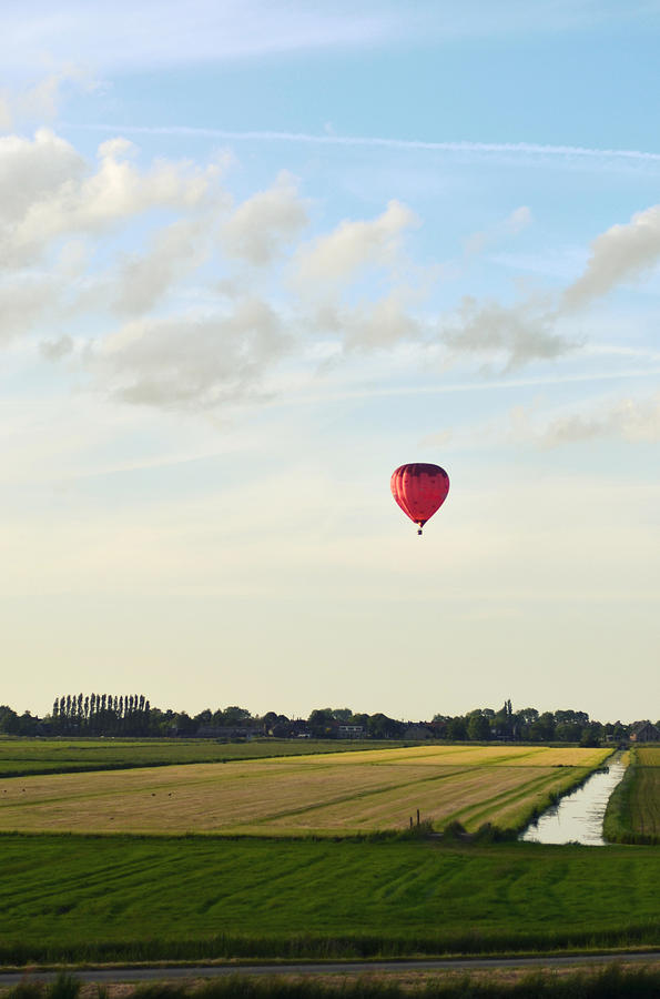 Red Hot Air Balloon Above Polder Field Photograph by Photo By Ira Heuvelman-dobrolyubova