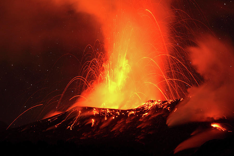 Red Hot Lava And Sparks Erupting From The Tavurvur Volcano At Night ...