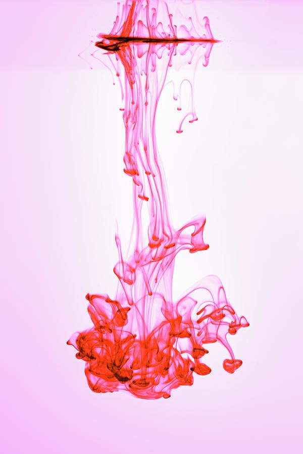 Red Ink Dripping Into Water Photograph by Krger & Gross