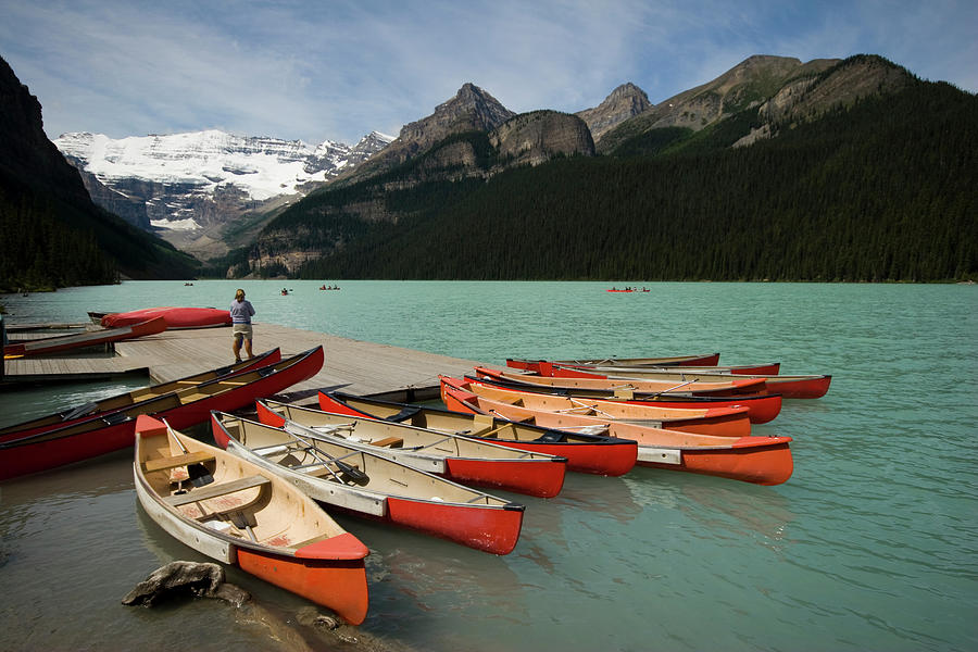 Red Kayak Boats On Lake Louise Photograph by © Francois Marclay