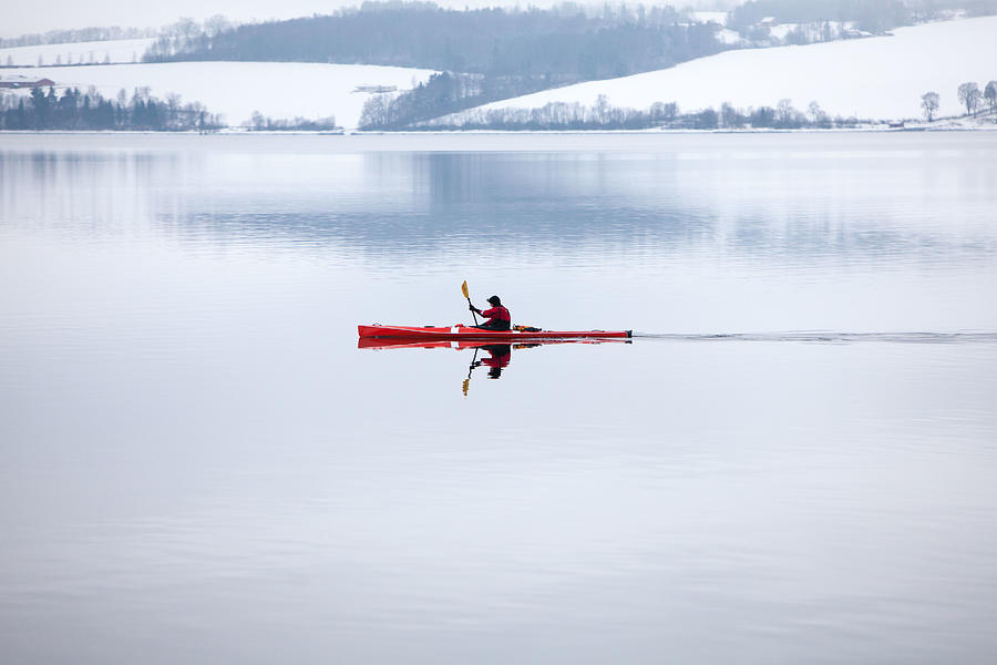 Red Kayak On Winter Lake Photograph by Anna A. Krømcke