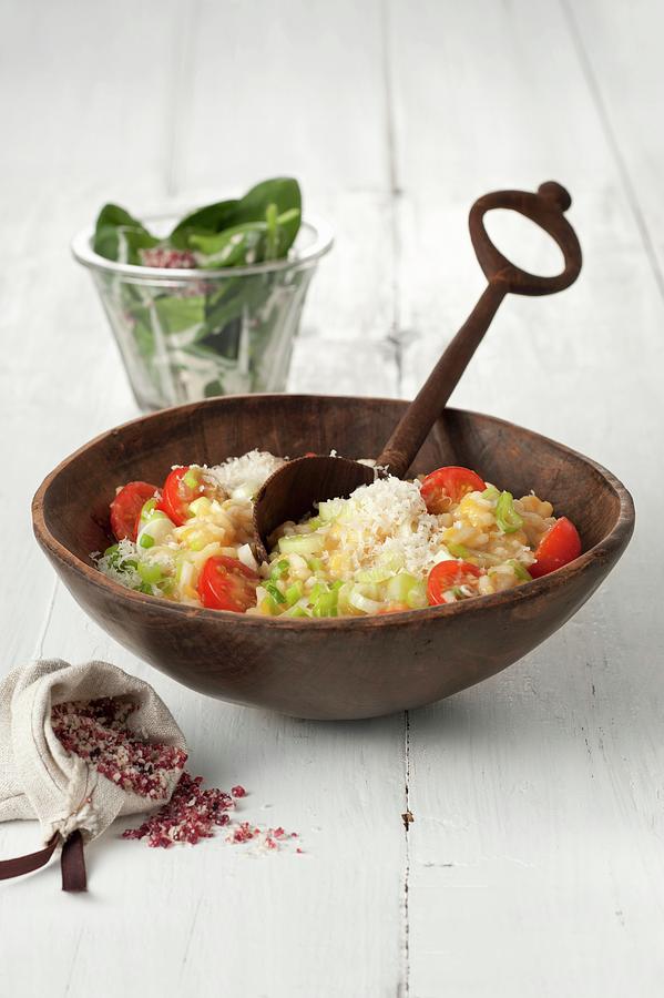 Red Lentil Risotto With Cherry Tomatoes, Parmesan, And A Spinach Salad Photograph by Hans Gerlach