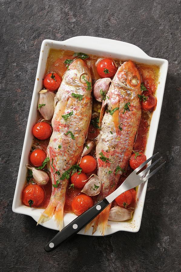 Red Mullets Stuffed With Cherry Tomatoes And Garlic Photograph by Jean-christophe Riou