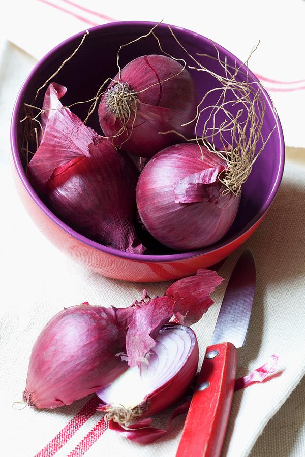 Red Onions, Whole And Halved Photograph by Hilde Mche