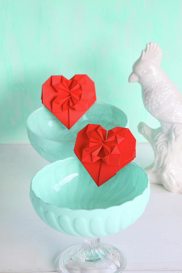 Red Origami Hearts In Turquoise Dessert Bowls Next To China Bird Photograph by Regina Hippel