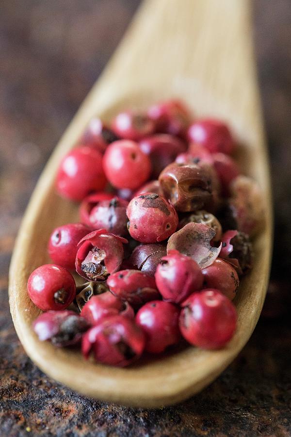 Red Peppercorns On A Wooden Spoon close-up Photograph by Nicole Godt