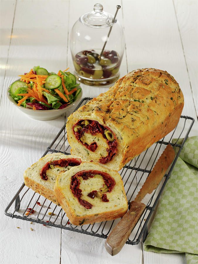 Red Pesto Roll With Salami And Black Olives Photograph by Stockfood Studios / Photoart