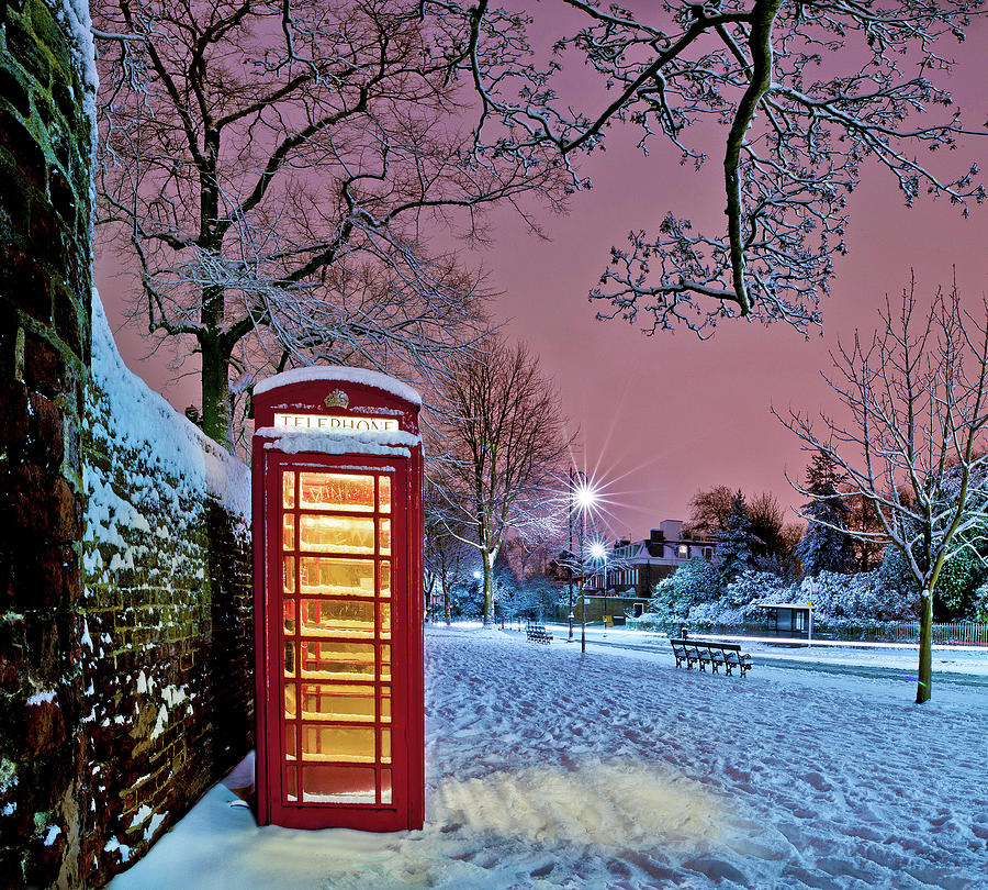 Red Phone Box Covered In Snow Photograph by Photo By John Quintero