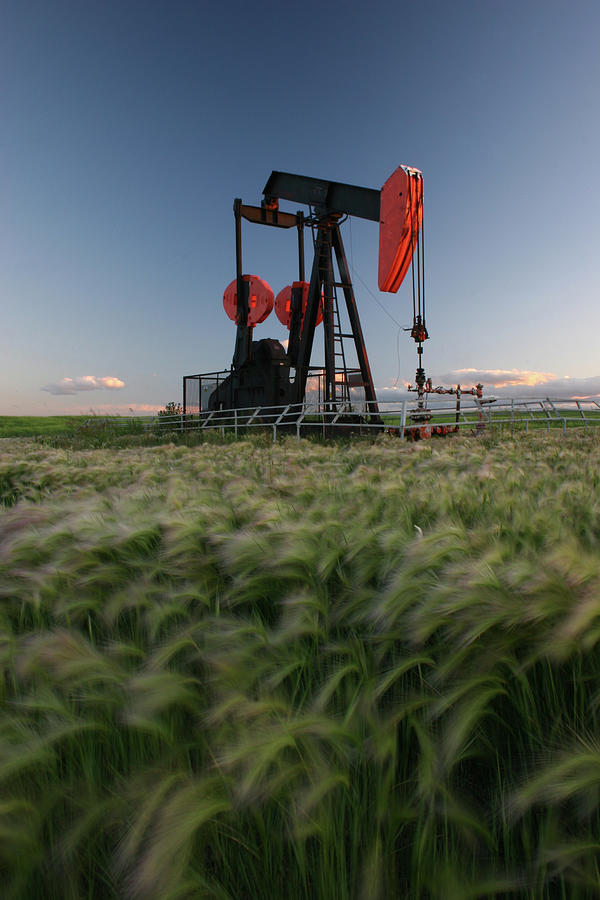 Red Pumpjack In Alberta Crude Oil Field Photograph by Imaginegolf
