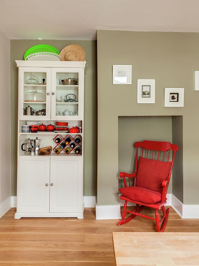 Red Rocking Chair In Niche Next To Kitchen Dresser Photograph by Simon Maxwell Photography