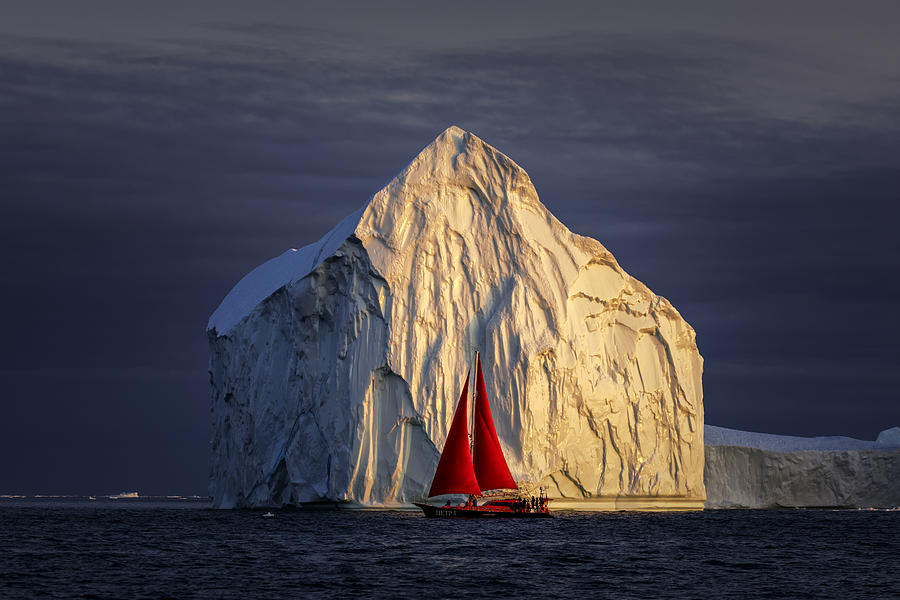 Red Sailboat And Giant Iceberg At Midnight Ilulissat Photograph by Raymond Ren Rong Liu