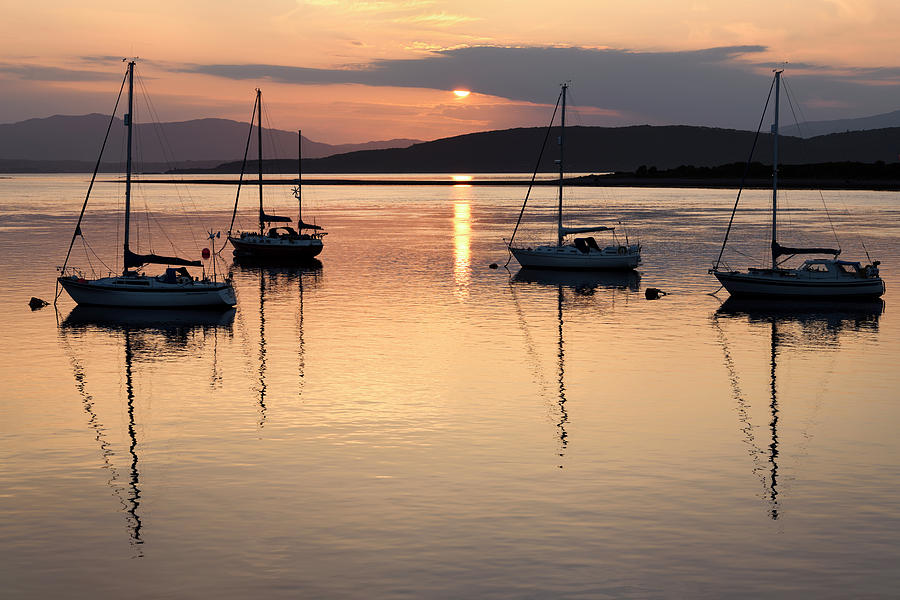 Red sky at sunset reflecting on the water of Ardmucknish Bay at  Photograph by Reimar Gaertner