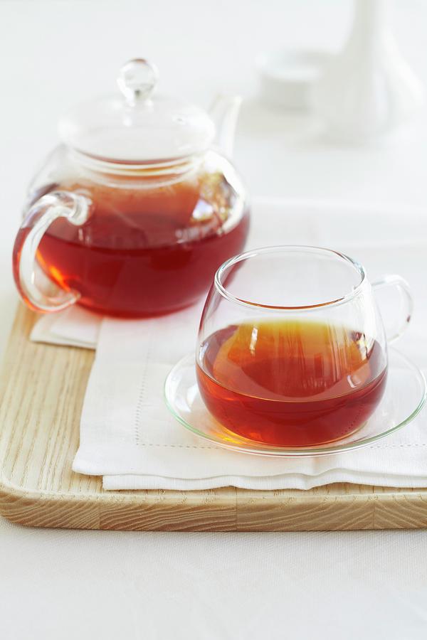 Redbush Tea In A Glass Teapot And A Cup Photograph by Charlotte Tolhurst