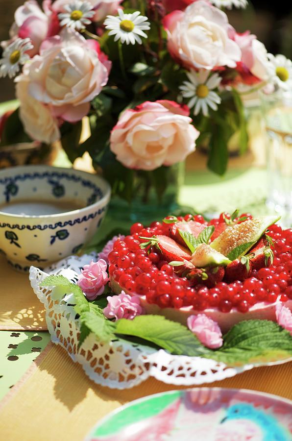 Redcurrant Cake And Bouquet On Set Table In Garden Photograph by Winfried Heinze
