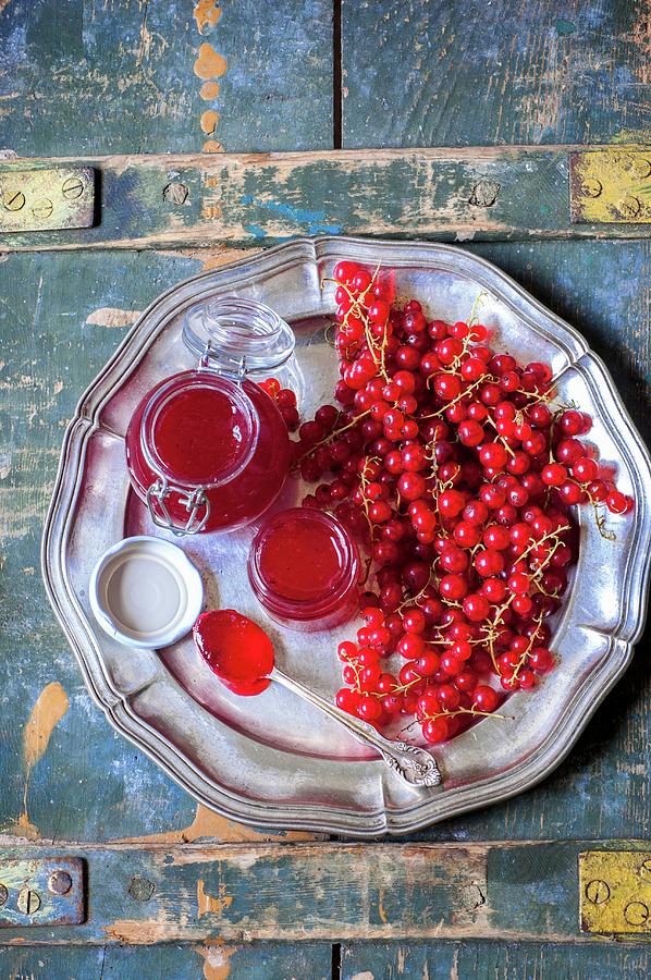 Redcurrant Jam In Glass Jars On A Metal Plate Photograph by Irina Meliukh