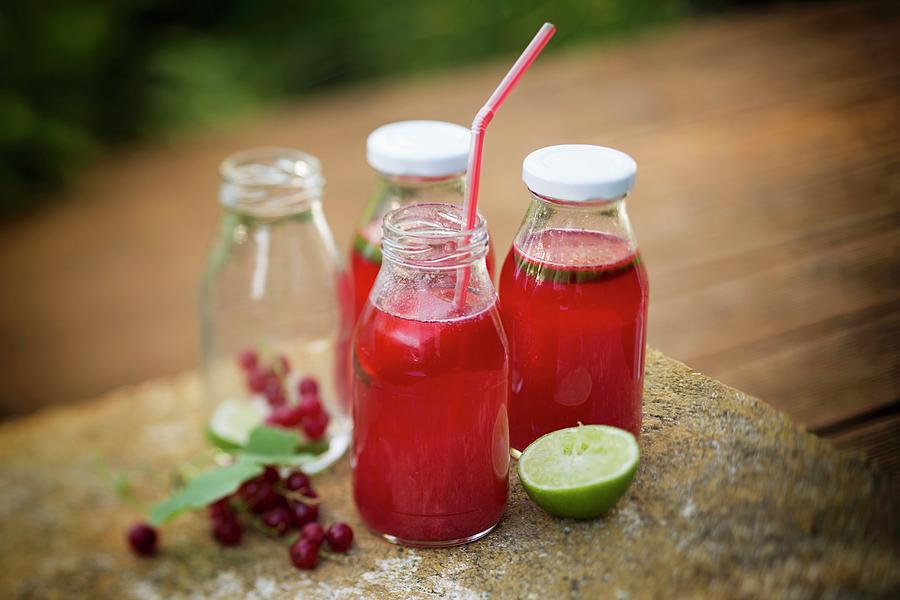 Redcurrant Lemonade With Lime Photograph by Jan Wischnewski