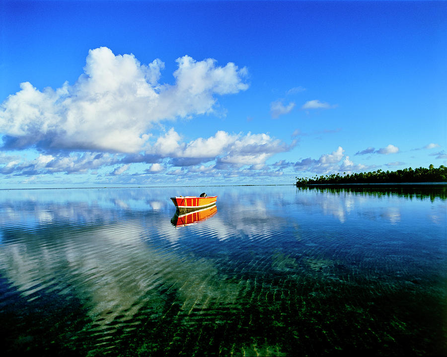Reflection Of Clouds And Boat On Water Photograph by Panoramic Images
