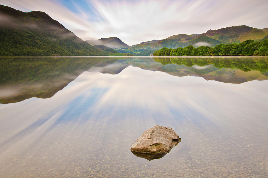 Reflection Of Mountains And Trees On Photograph by John Ormerod