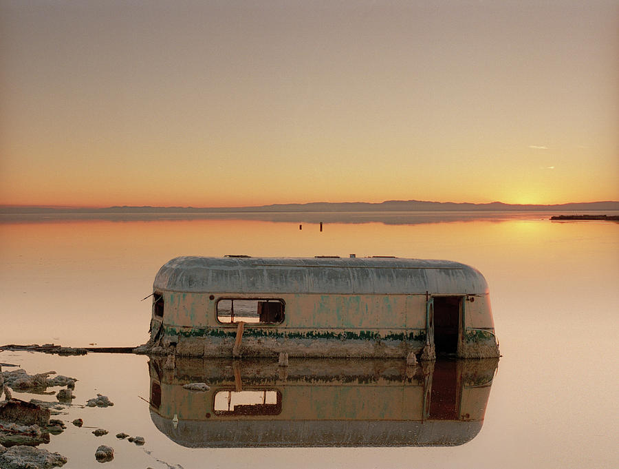 Reflection Of Rusty Trailer Sinking In Photograph by Ed Freeman