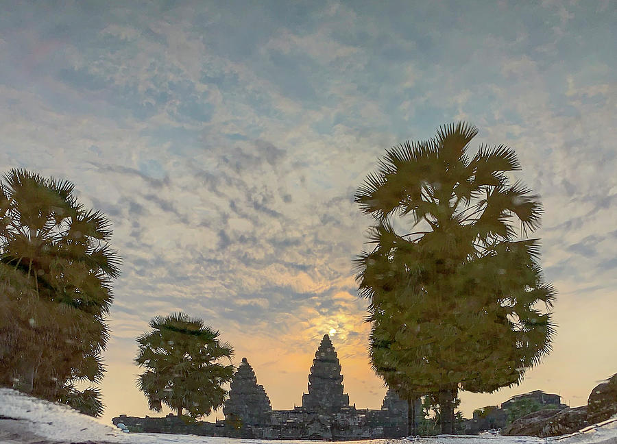 Reflection of sunrise in Angkor Wat Photograph by Karen Foley