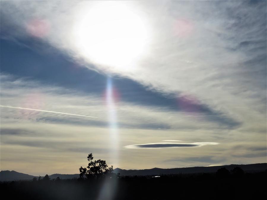 Reflection Of The Sun Though Clouds Walking In New Mexico Photograph