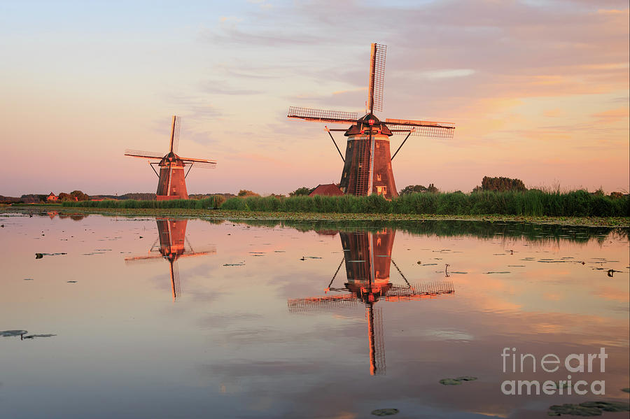 Windmills Photograph - Reflection Of Two Traditional Windmills In The Water At Sunset by IPics Photography Windmills Photograph - Reflection Of Two Traditional Windmills In The Water At Sunset by IPics Photography