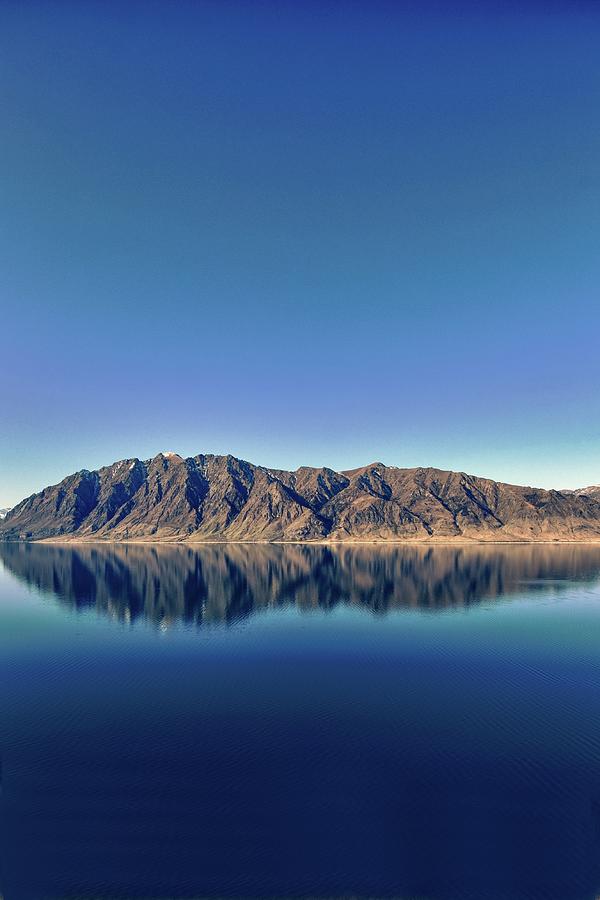 Reflections On Lake Hawea Photograph by Verity E. Milligan