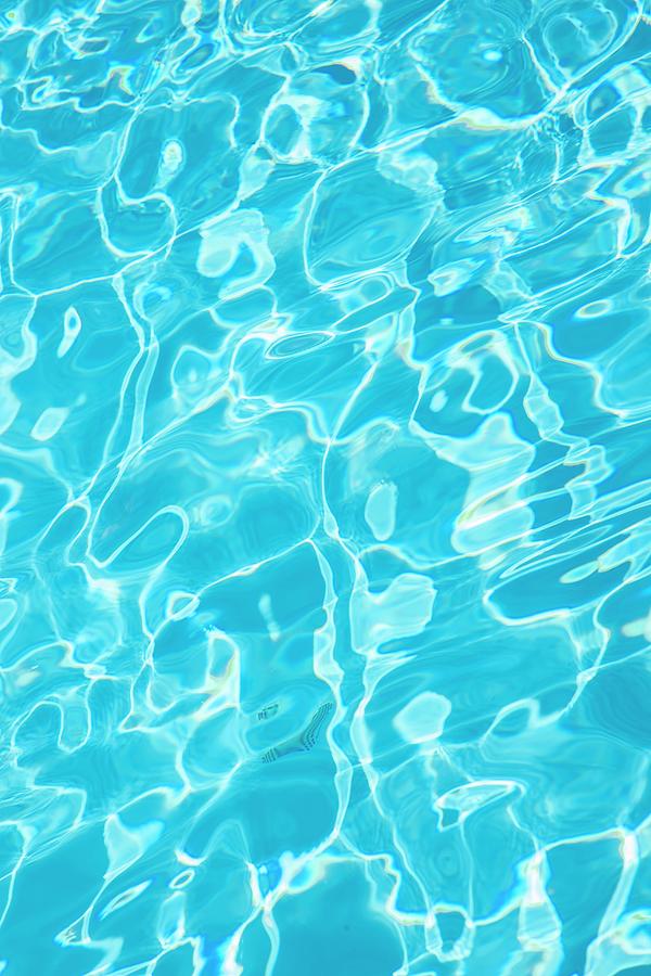 Reflections On Water In Blue Swimming Pool Photograph by Christophe Madamour