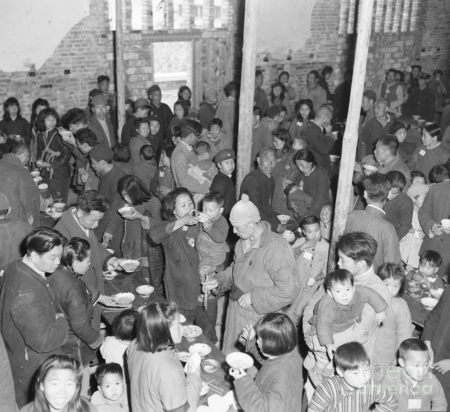 Refugee Parents In Mess Hall Eat Standin Photograph by Bettmann